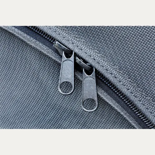 Close-up of the double YKK zipper pulls on a D-Flector boat stone guard mesh cover